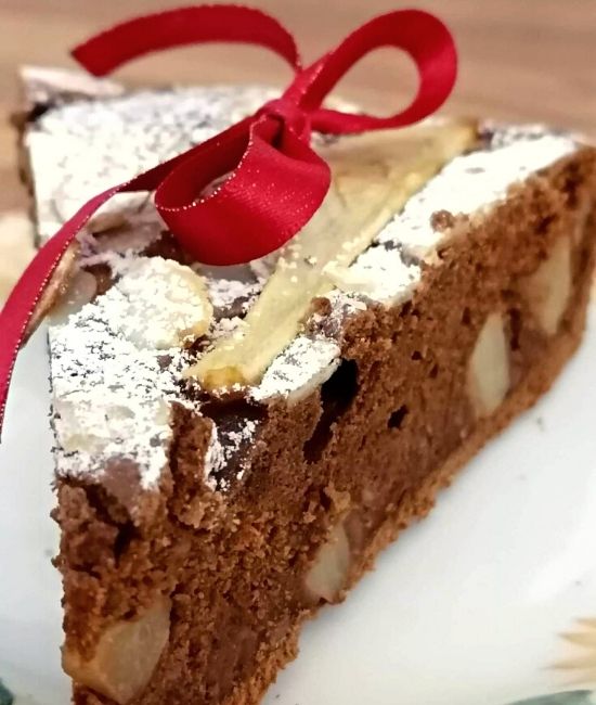 pear and almond chocolate cake slice with red bow