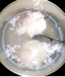 poaching eggs in boiling water